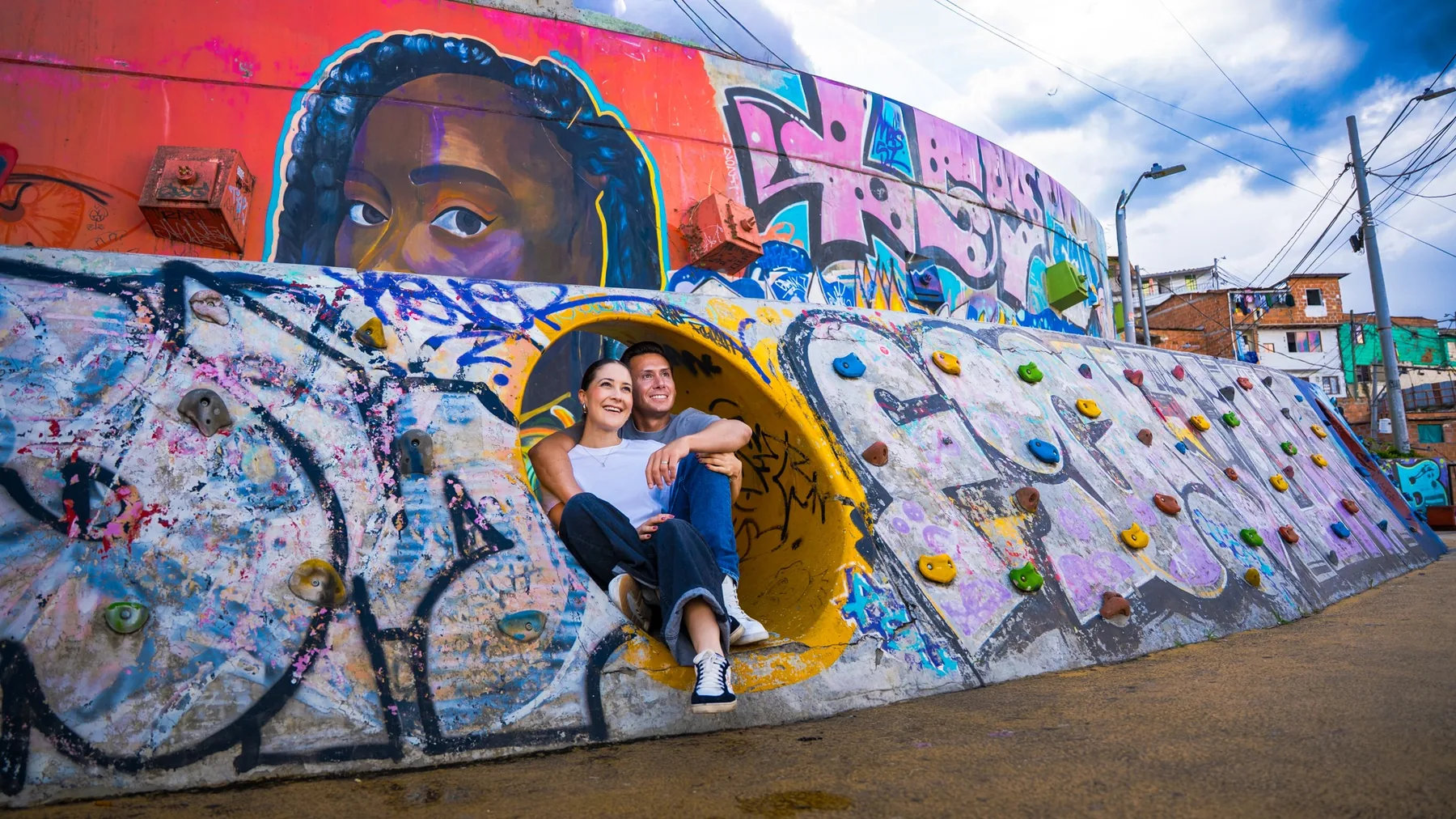 Travelers exploring Medellín street art