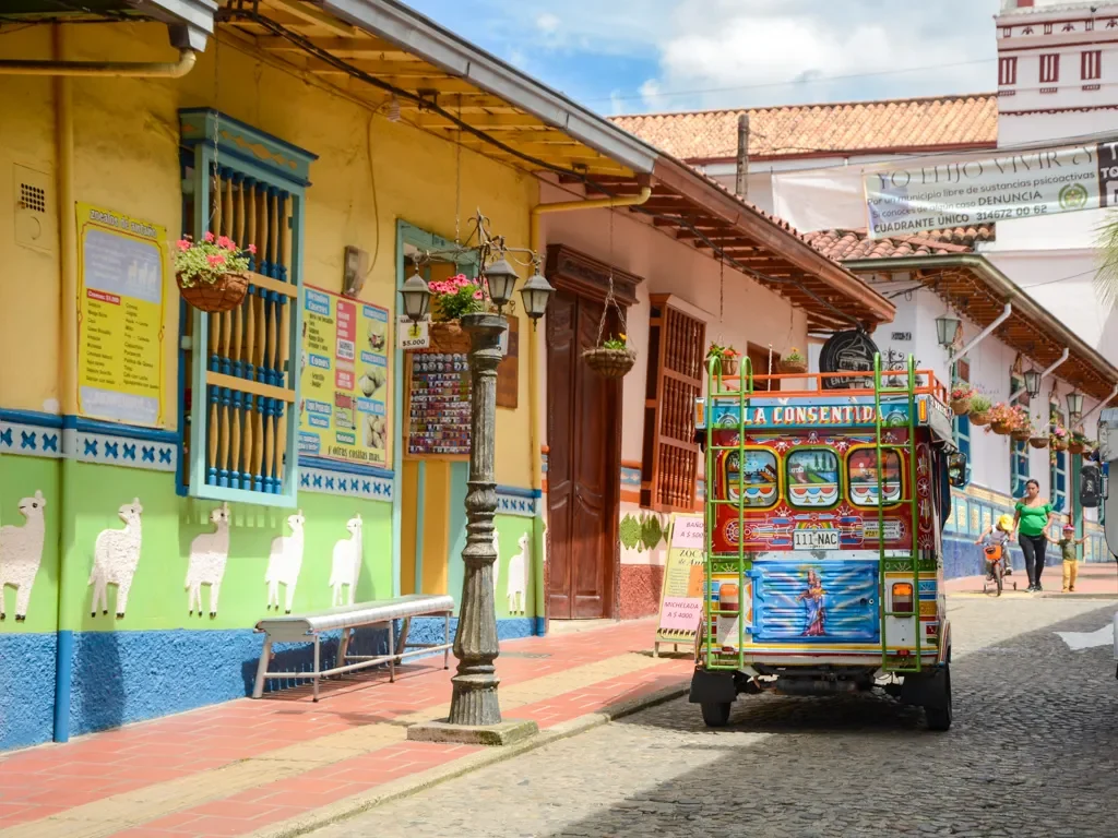 Colorful tuk-tuk and traditional façades in Guatapé